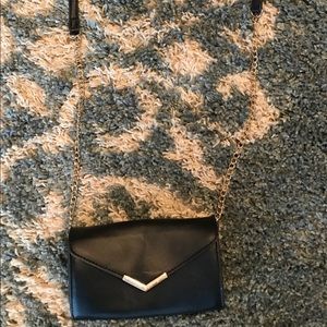 Black Cross over. Gold Hardware